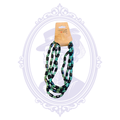 Black and teal 48-inch multi-strand beaded statement necklace with rectangular black beads and translucent teal accents.