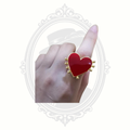 Woman wearing ClaudiaG red heart statement ring