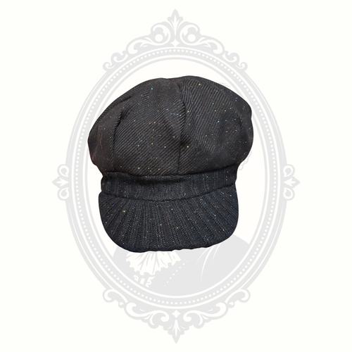 Angled front view of black glitter speckled newsboy cap for girls