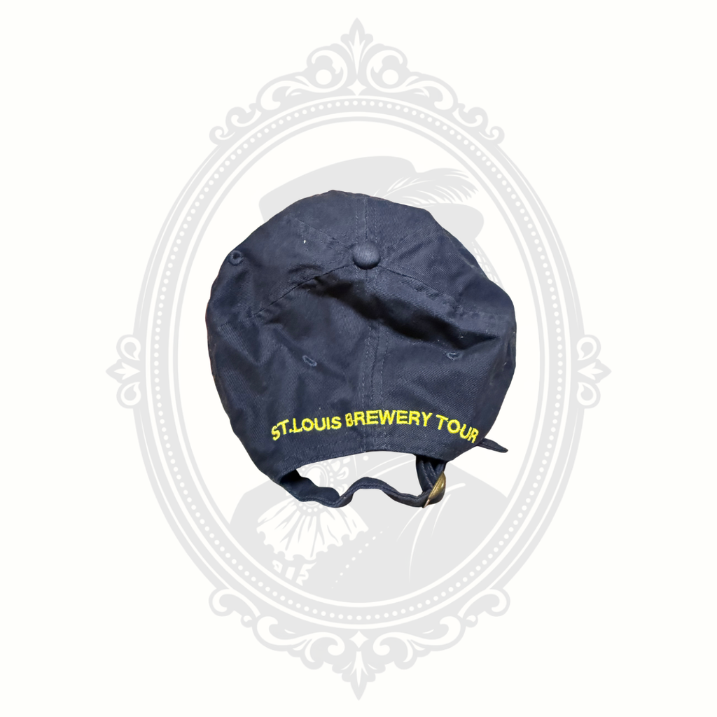 Back view of navy Budweiser brewery tour adjustable hat with embroidered St. Louis Brewery Tour text