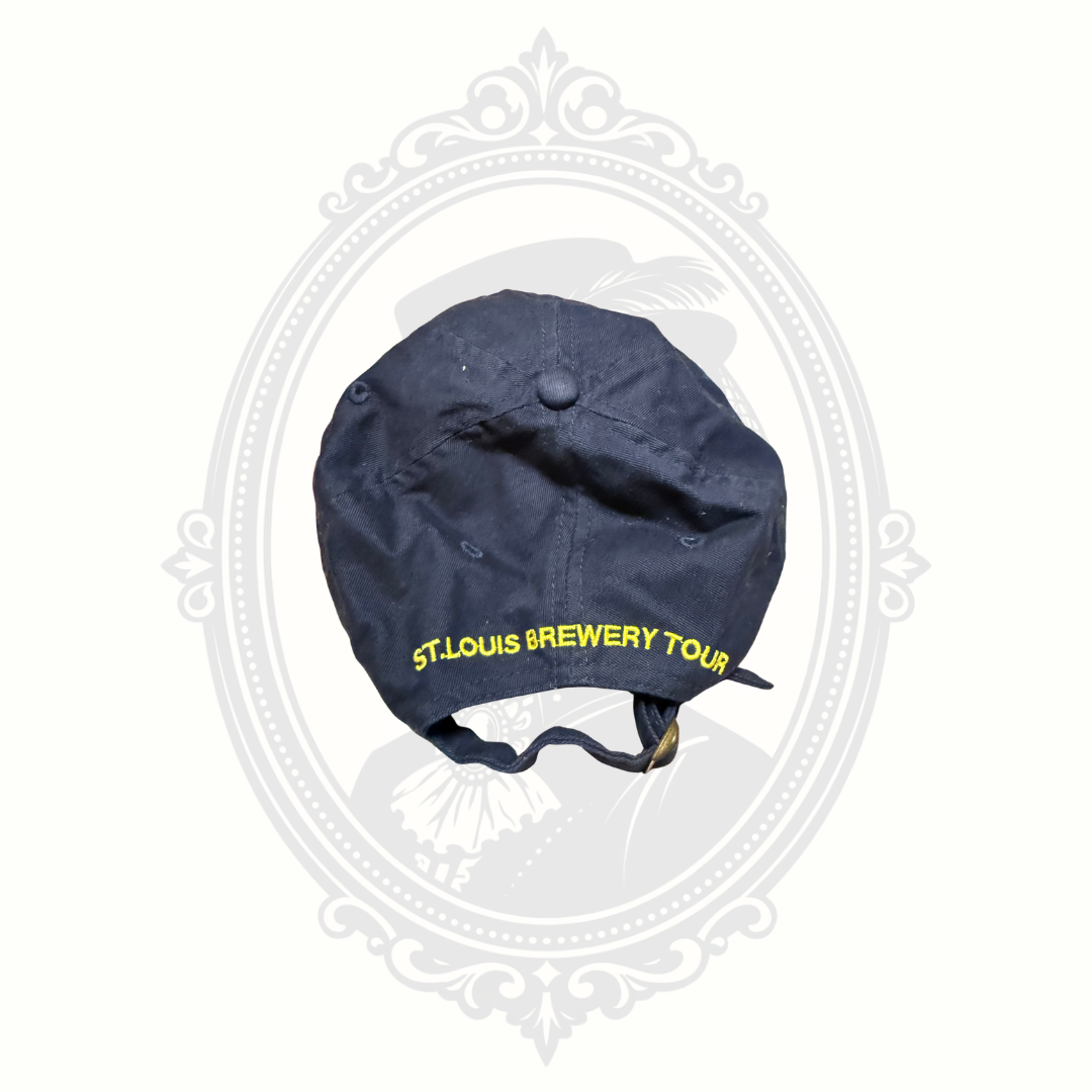 Back view of navy Budweiser brewery tour adjustable hat with embroidered St. Louis Brewery Tour text