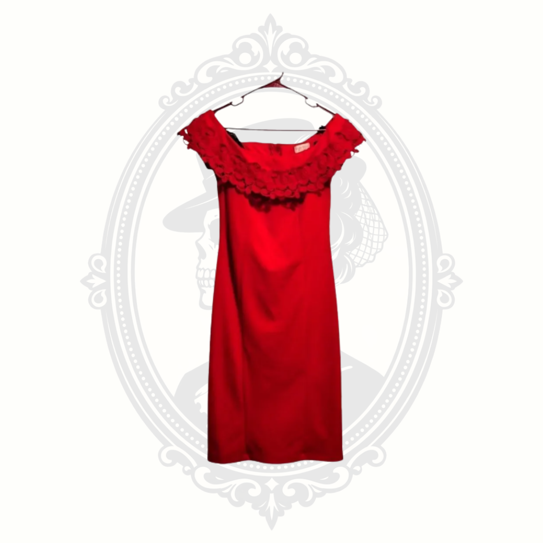 Elegant red Bisou Bisou cocktail midi dress displayed on a hanger with floral neckline detail.