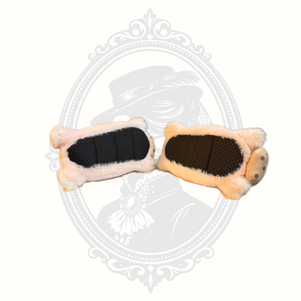 Bottom view of pink plush bunny slippers with black non-slip soles