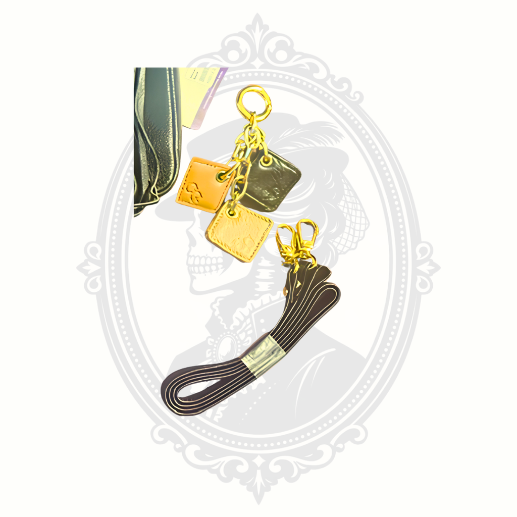 ClaudiaG signature charm and detachable leather wrist strap