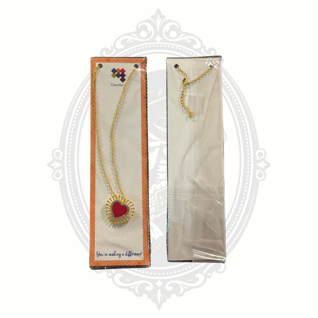 Retail product image of the ClaudiaG Lumi Necklace showing the red enamel heart pendant and chain.