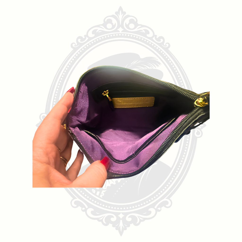 Purple lined interior of ClaudiaG Willow handbag showing zip pocket