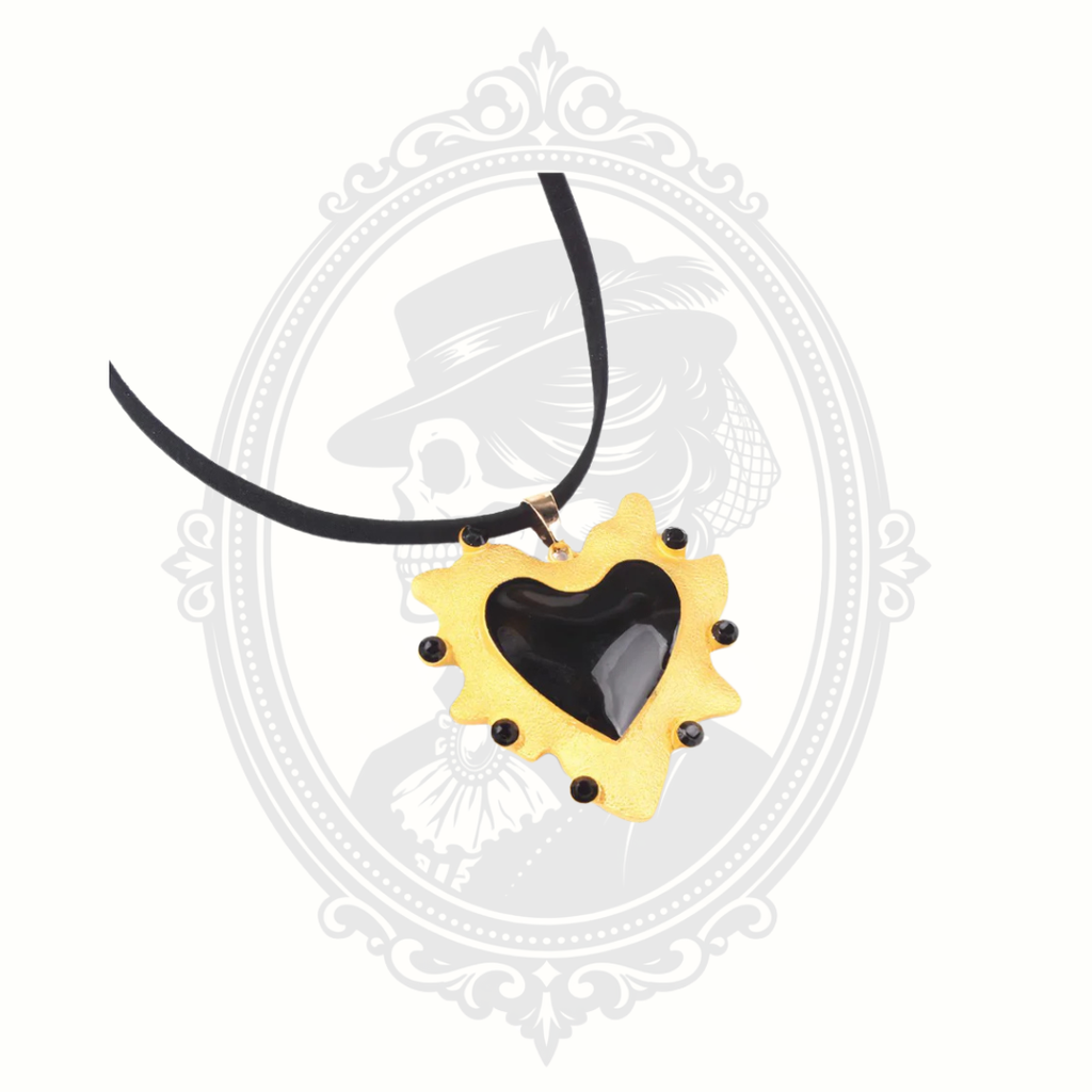 ClaudiaG black heart necklace with gold sunburst pendant on black velvet cord