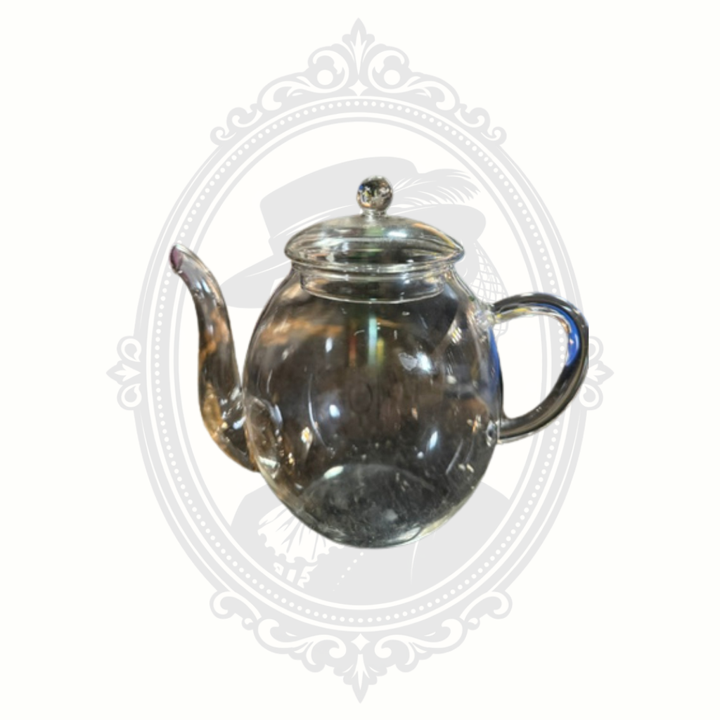 Side profile of minimalist Creano glass teapot showing elegant curved handle and rounded body design.