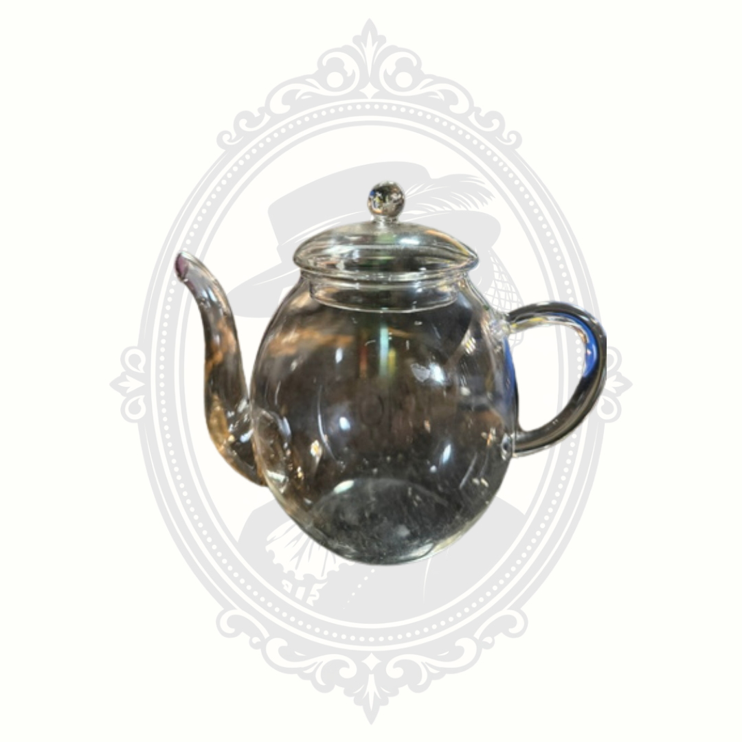 Side profile of minimalist Creano glass teapot showing elegant curved handle and rounded body design.