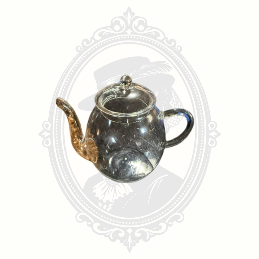 Side profile of minimalist Creano glass teapot showing elegant curved handle and rounded body design.
