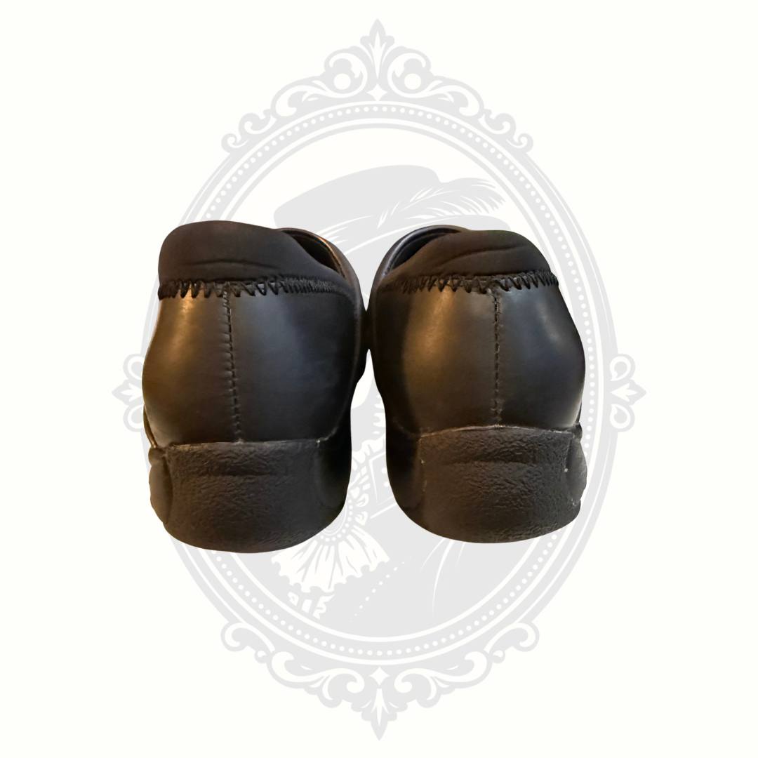 Rear view of black leather Dansko professional work shoes
