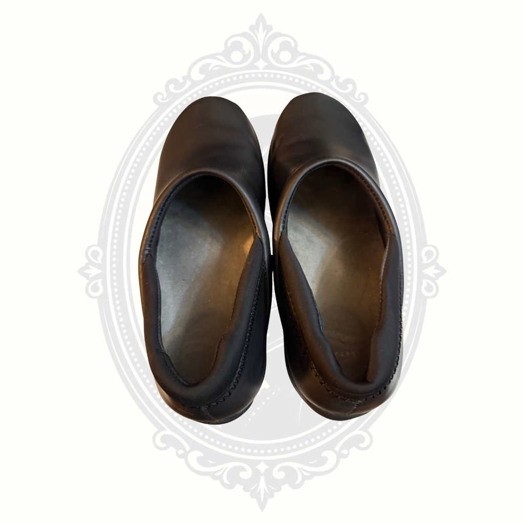 Top view of black Dansko comfort clogs showing interior footbeds