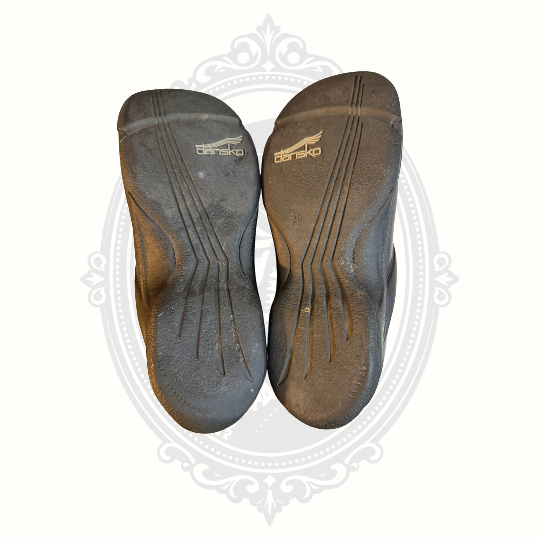 Bottom sole view of black Dansko slip resistant clogs