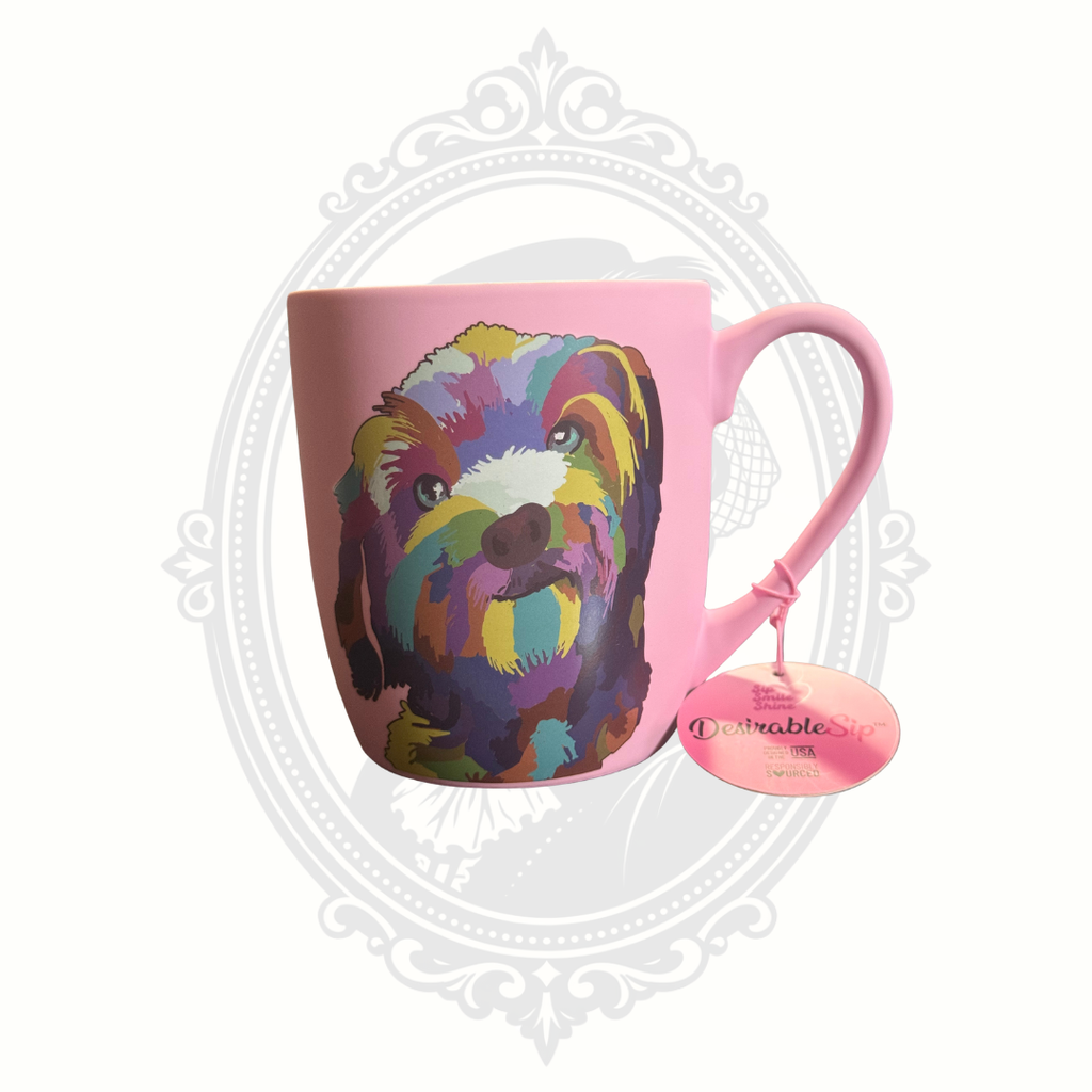 Reverse side of pink DesirableSip stoneware mug displaying colorful dog artwork and attached original retail tag.