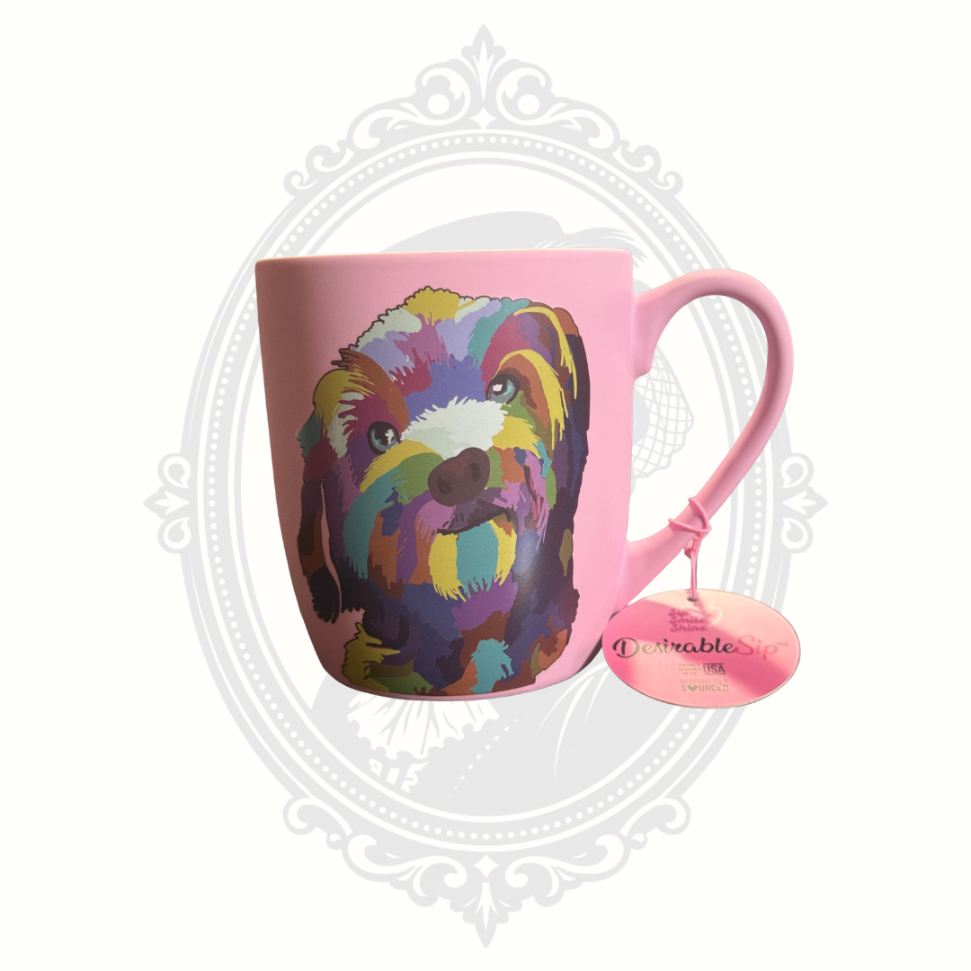 Reverse side of pink DesirableSip stoneware mug displaying colorful dog artwork and attached original retail tag.