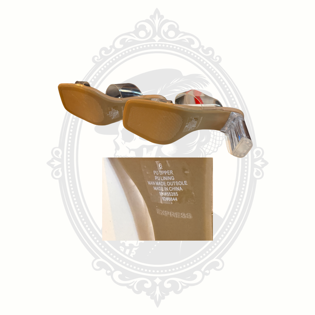Bottom sole view and size detail of Express transparent strap mule heels in women’s size 6.