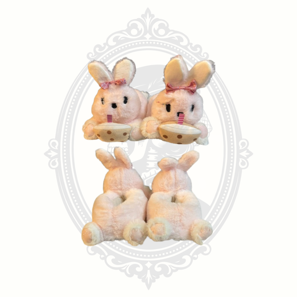 Front and rear comparison of pink bunny slippers with cocoa cup accents