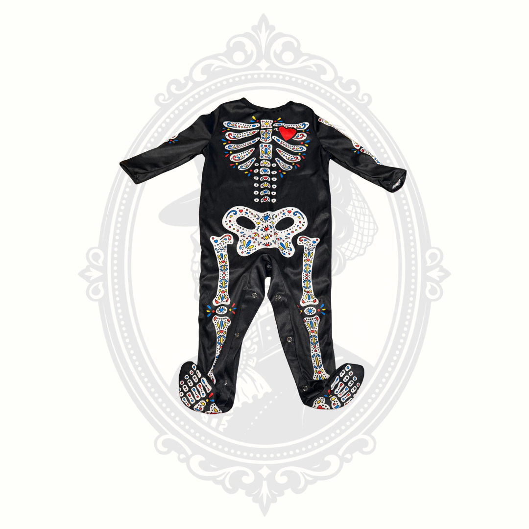 Front view of black baby skeleton costume with attached footies and colorful sugar skull design