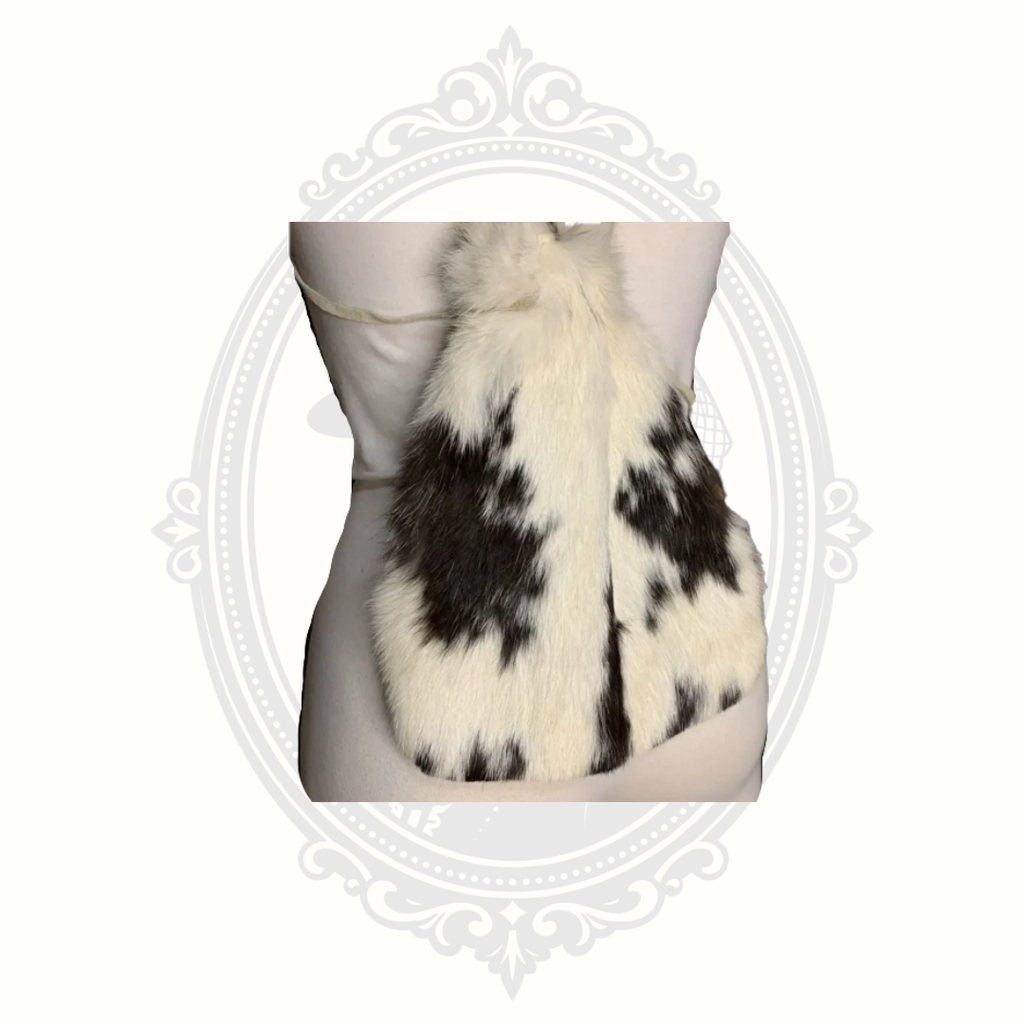 Back view of genuine rabbit fur backpack purse with natural white and brown fur pattern