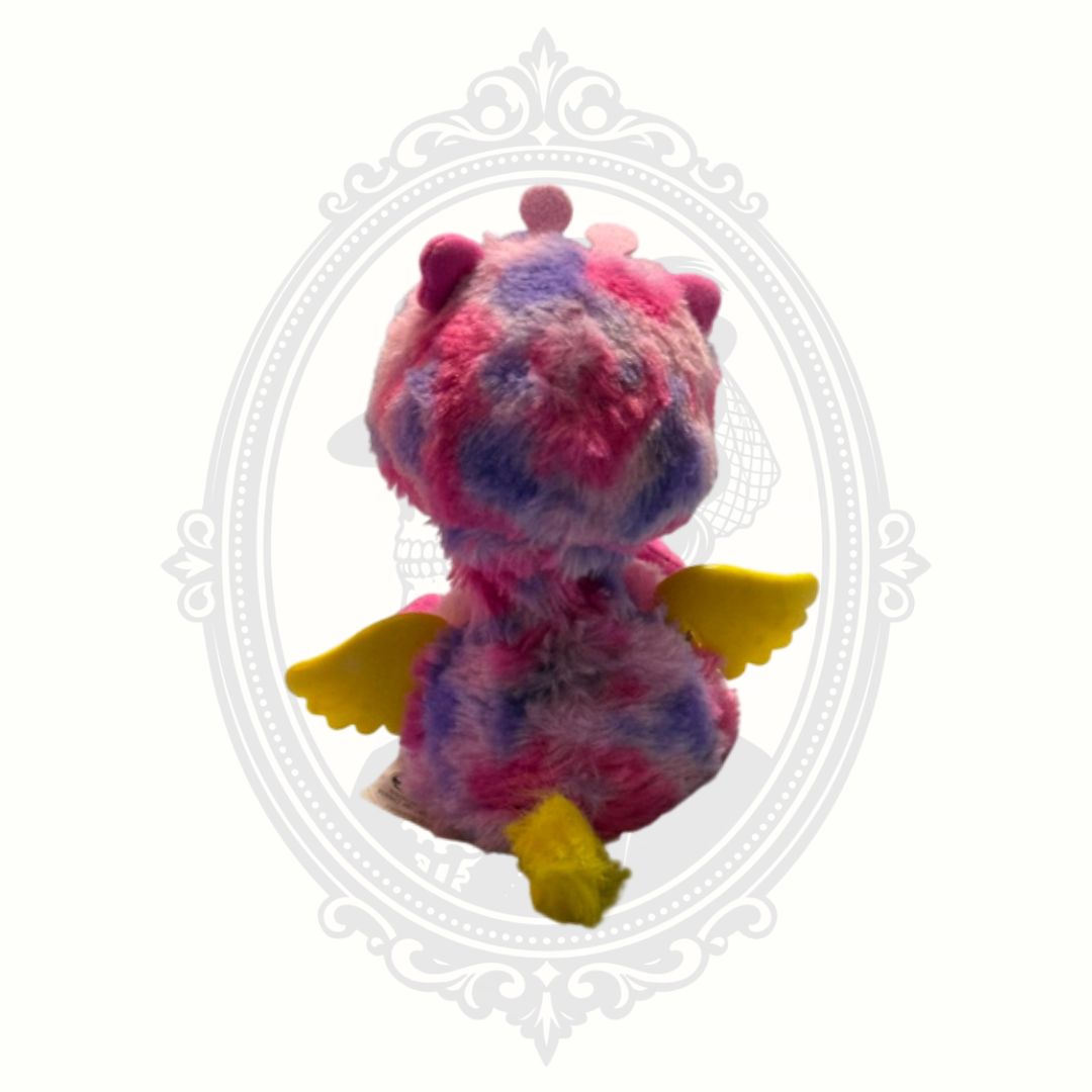 Back view of Hatchimals Pixies Hatchtopia plush dragon showing wings and tail