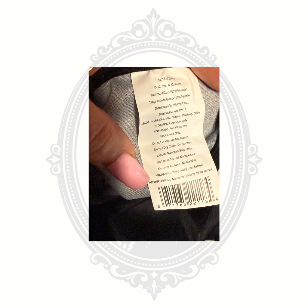 Interior tag showing sizing and material information for baby skeleton sleeper costume