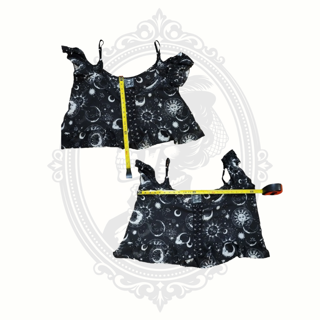 Flat lay measurements of Killstar Astral Light lace-up cold shoulder top in black celestial print