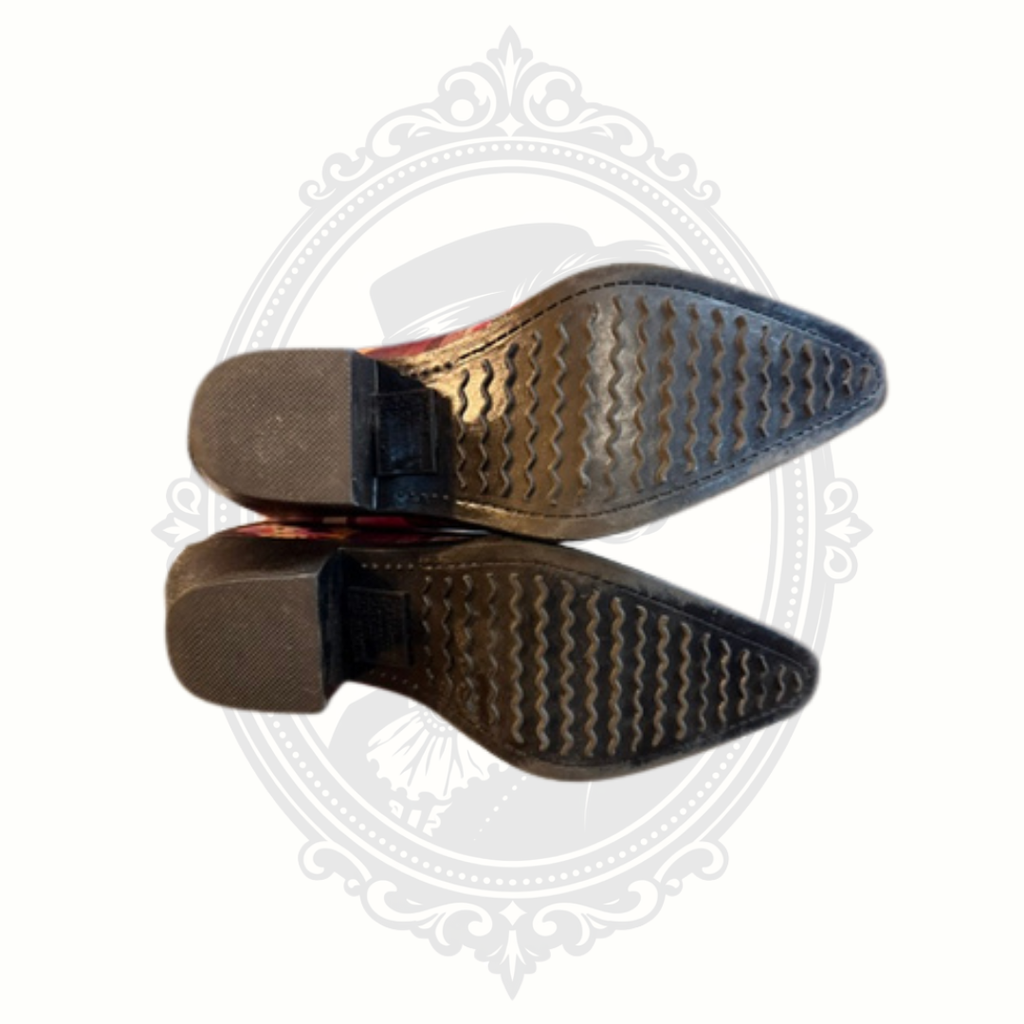 Bottom sole view of Madeline western-inspired rain boots showing tread pattern and condition.