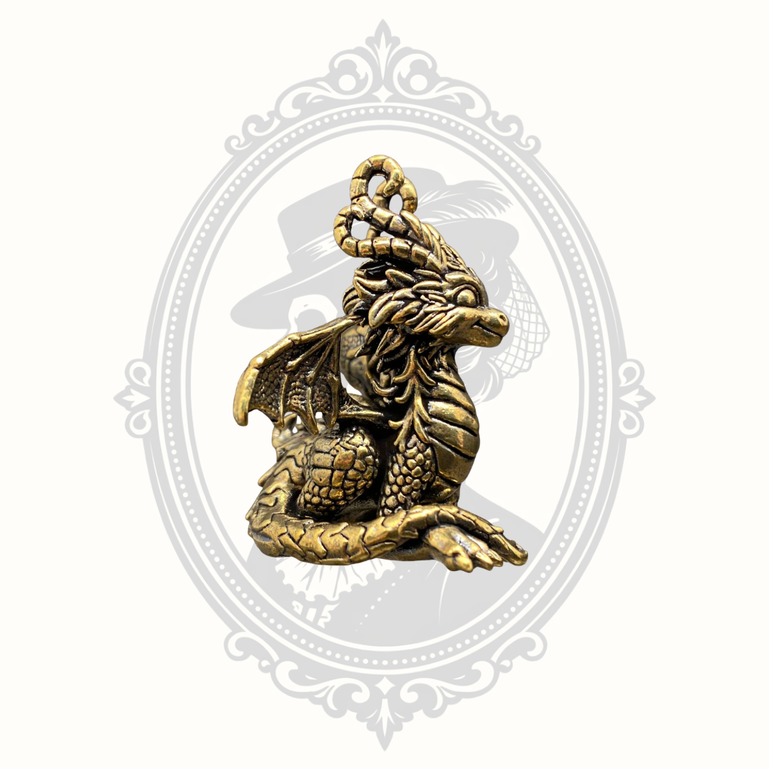 Angled view of miniature brass fantasy dragon statue.