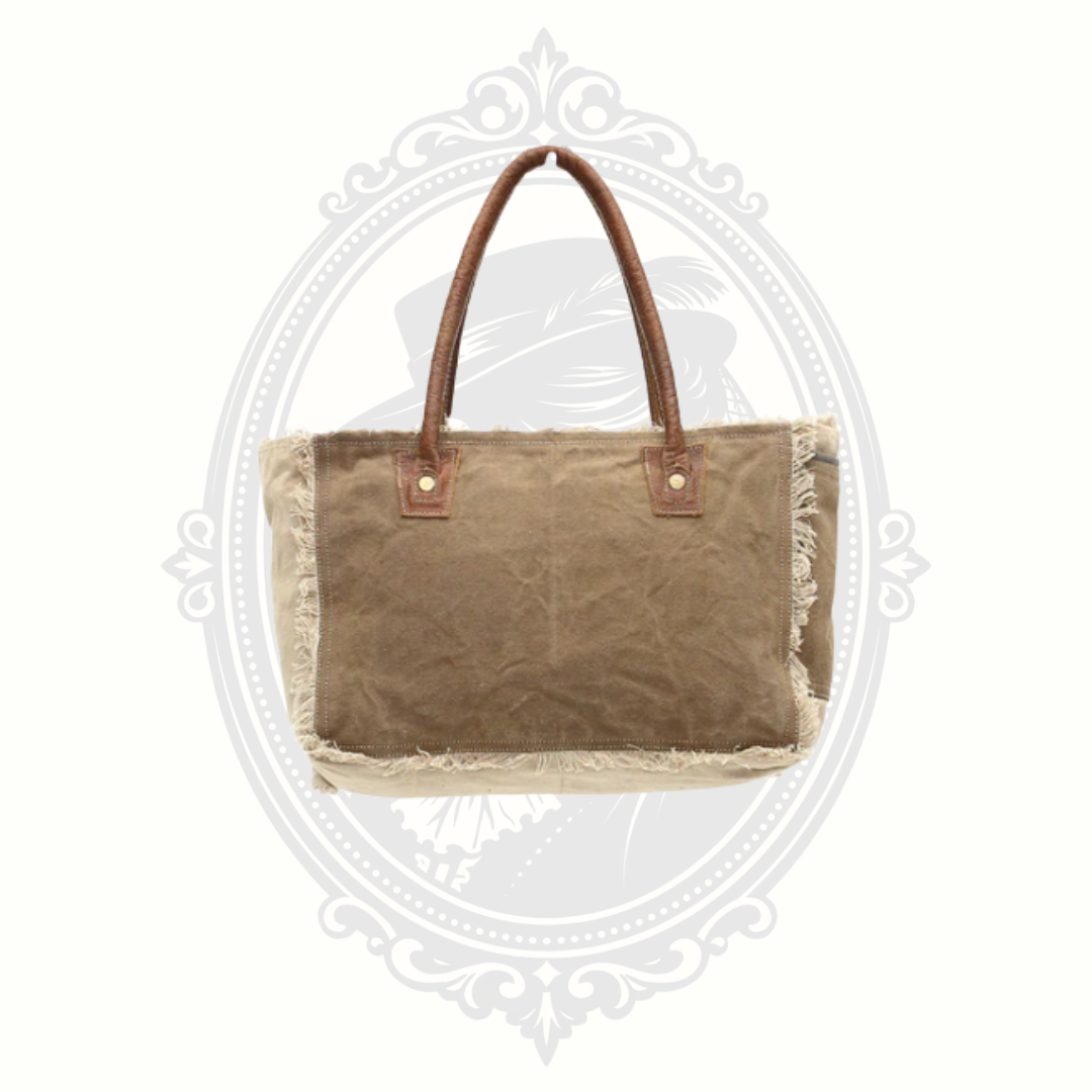 Brown tote bag with frayed edges on a white background