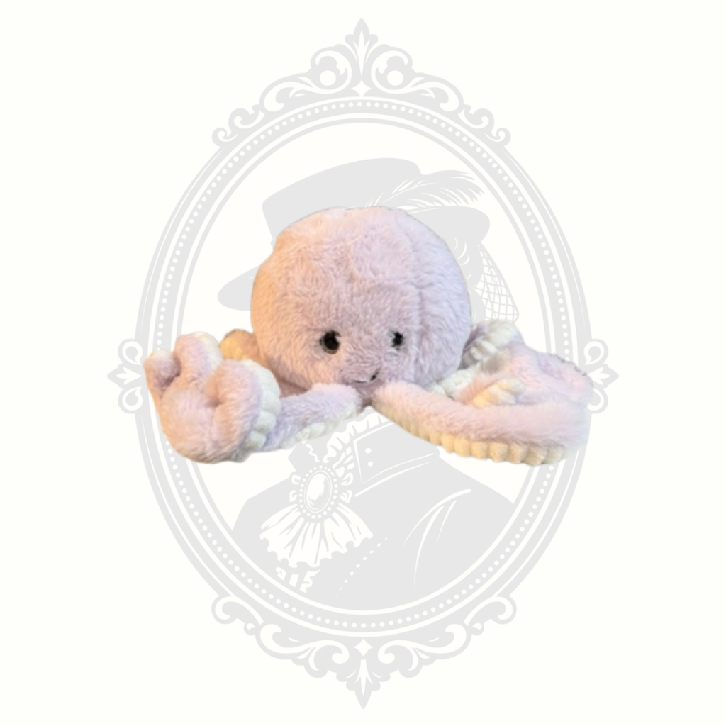 Soft pastel octopus plush toy with embroidered face and textured tentacles.