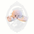Soft pastel octopus plush toy with embroidered face and textured tentacles.