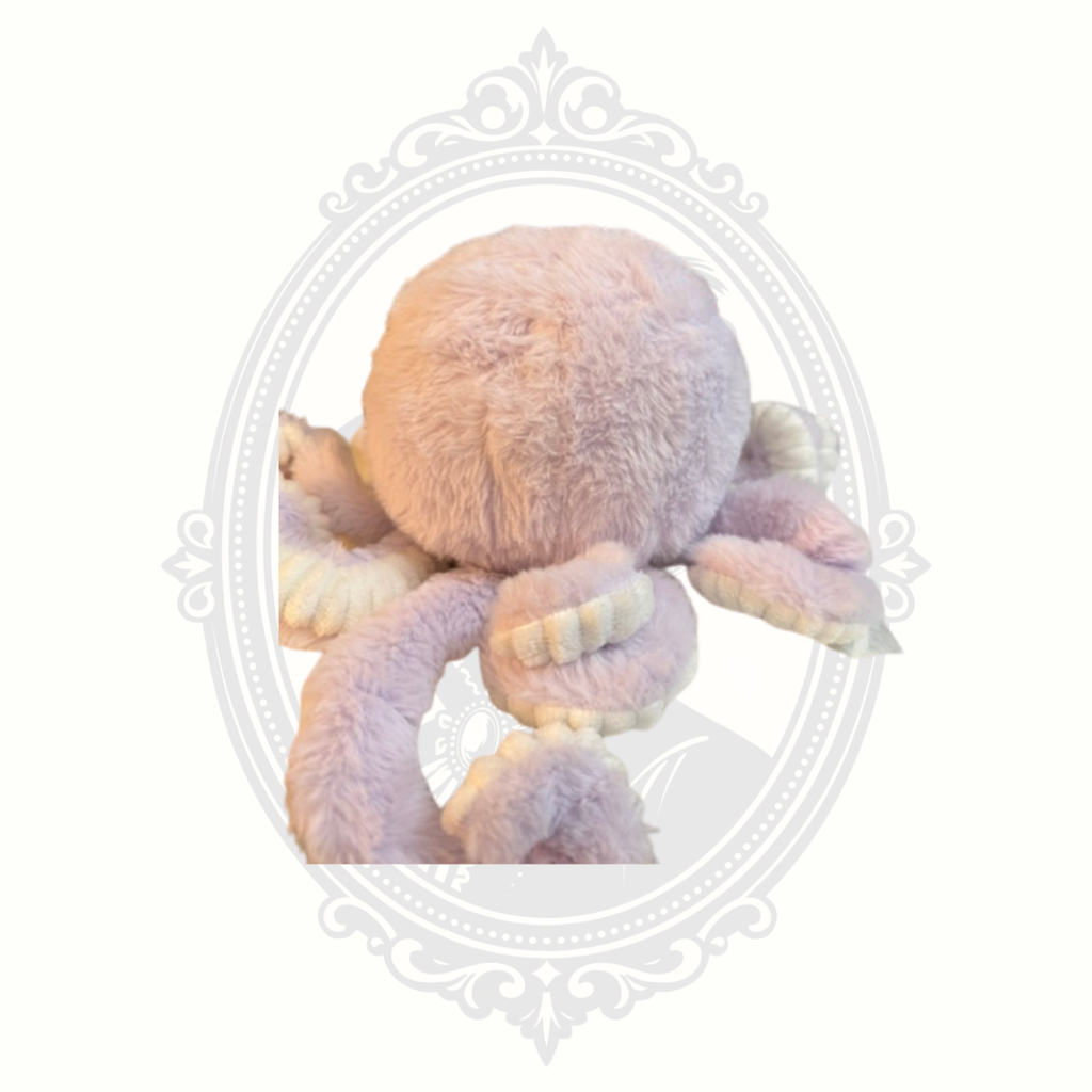 Soft pastel octopus plush toy with embroidered face and textured tentacles.