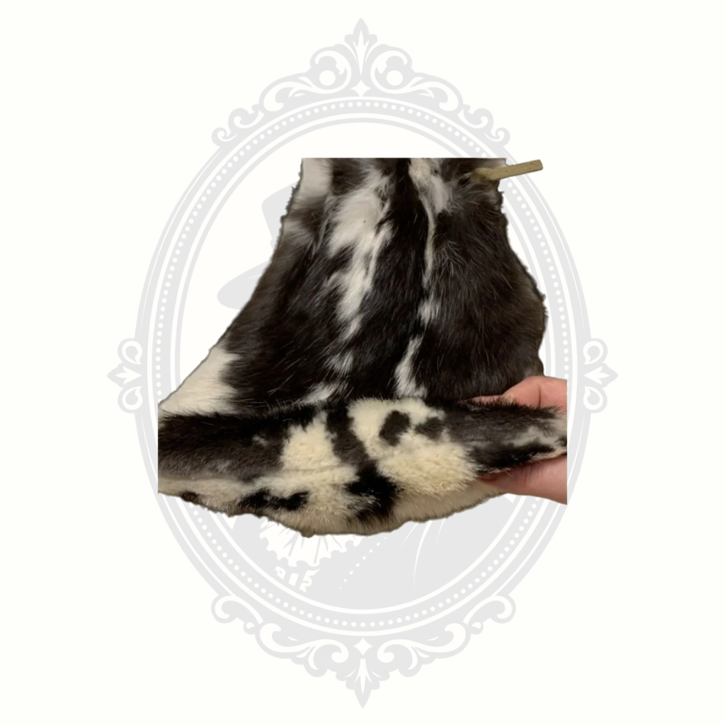 Bottom detail of genuine rabbit fur purse showing natural fur pattern and texture