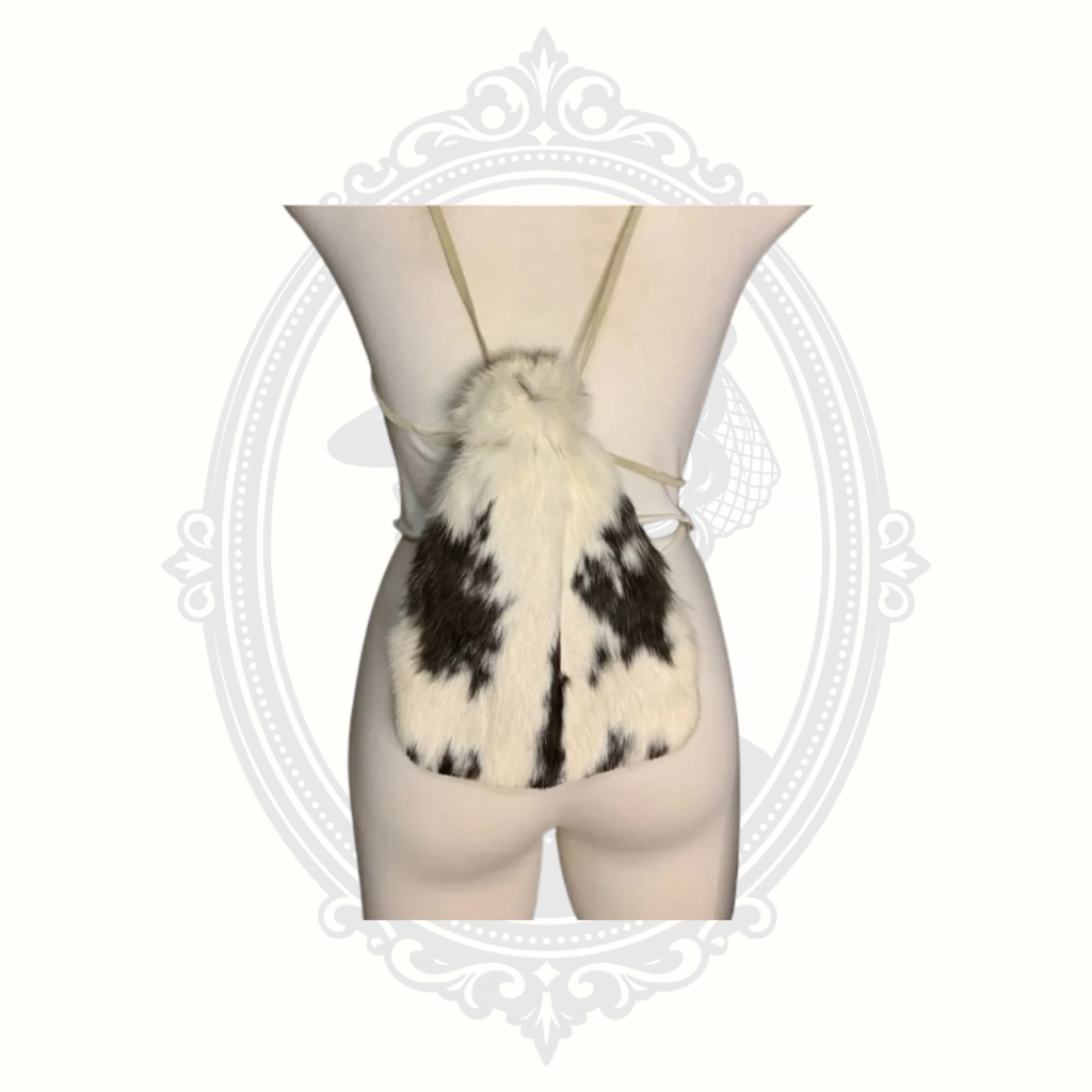 Front view of genuine rabbit fur drawstring backpack purse in white and brown fur