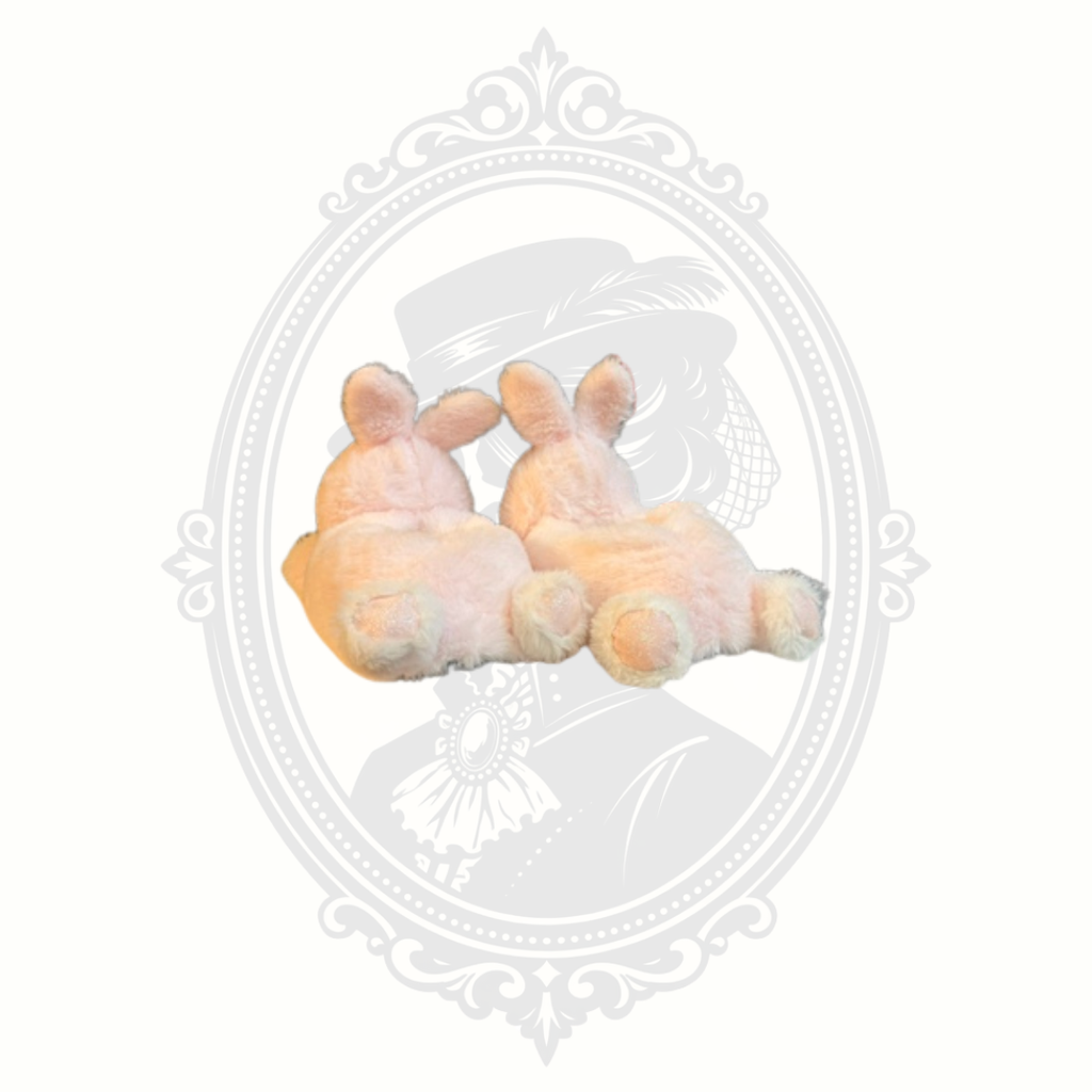 Rear view of fluffy pink bunny slippers with tails and ears