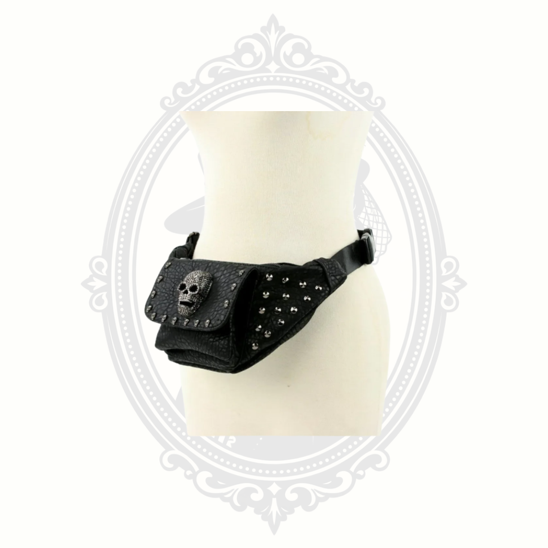 Side angle view of black gothic fanny pack with silver studs and skull accent