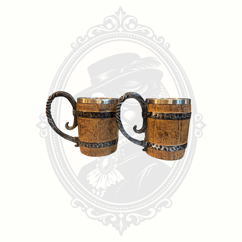 Pair of rustic barrel-style mugs with ornate wrought-iron style handles and faux wood texture.