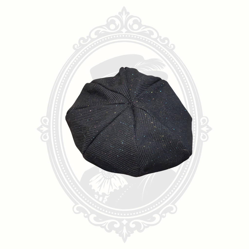 Top view of black glitter speckled girls newsboy cap
