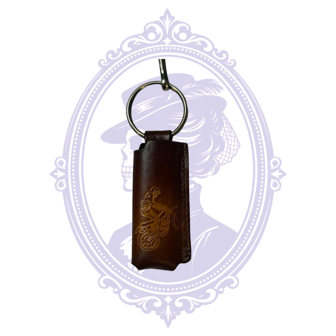 Front view of vintage embossed dirt bike rider leather lighter holder