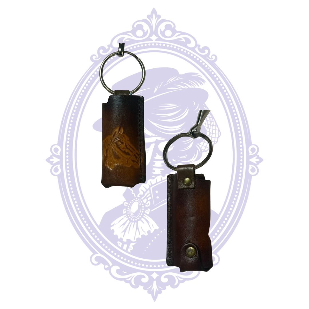 Front and back views of vintage leather horse head lighter holder