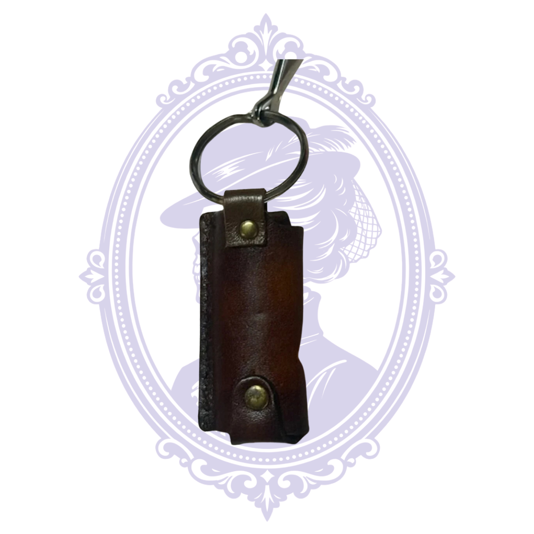 Back of brown leather horse head lighter holder with keyring and rivets