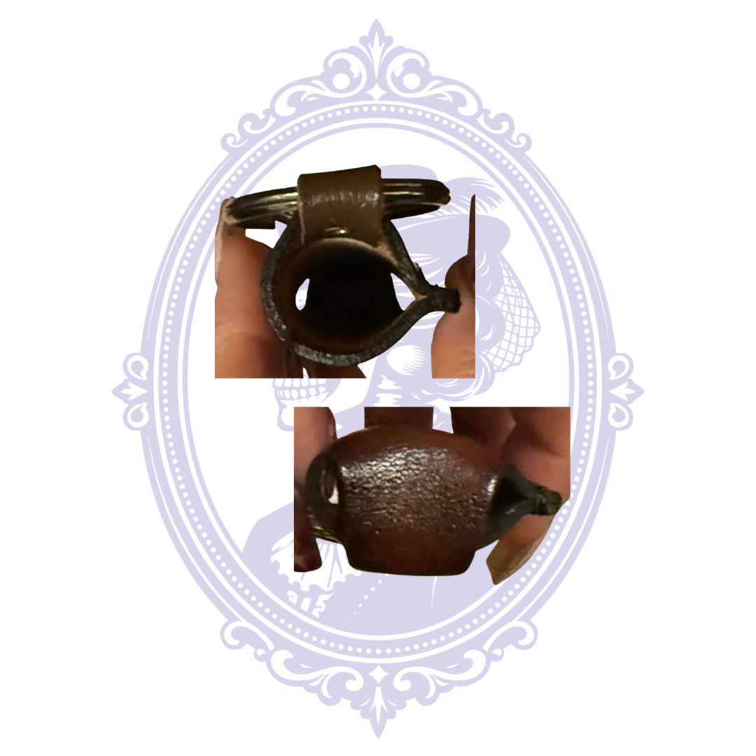 Close-up of opening and leather construction of vintage horse head lighter holder