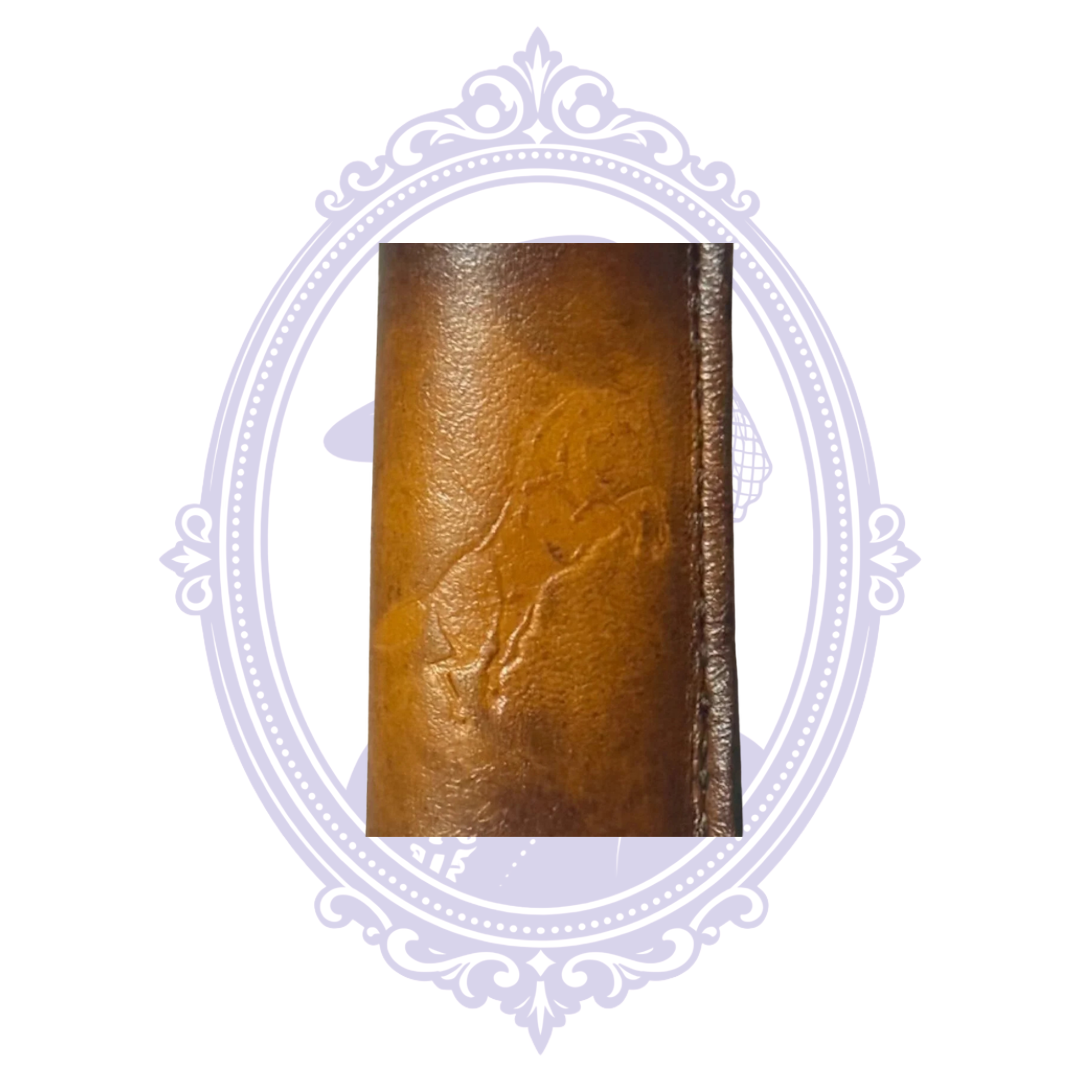 Close-up of embossed full-body horse design on brown leather