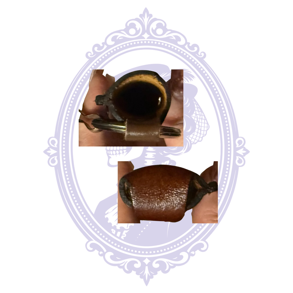 Close-ups of open leather lighter holder and stitching