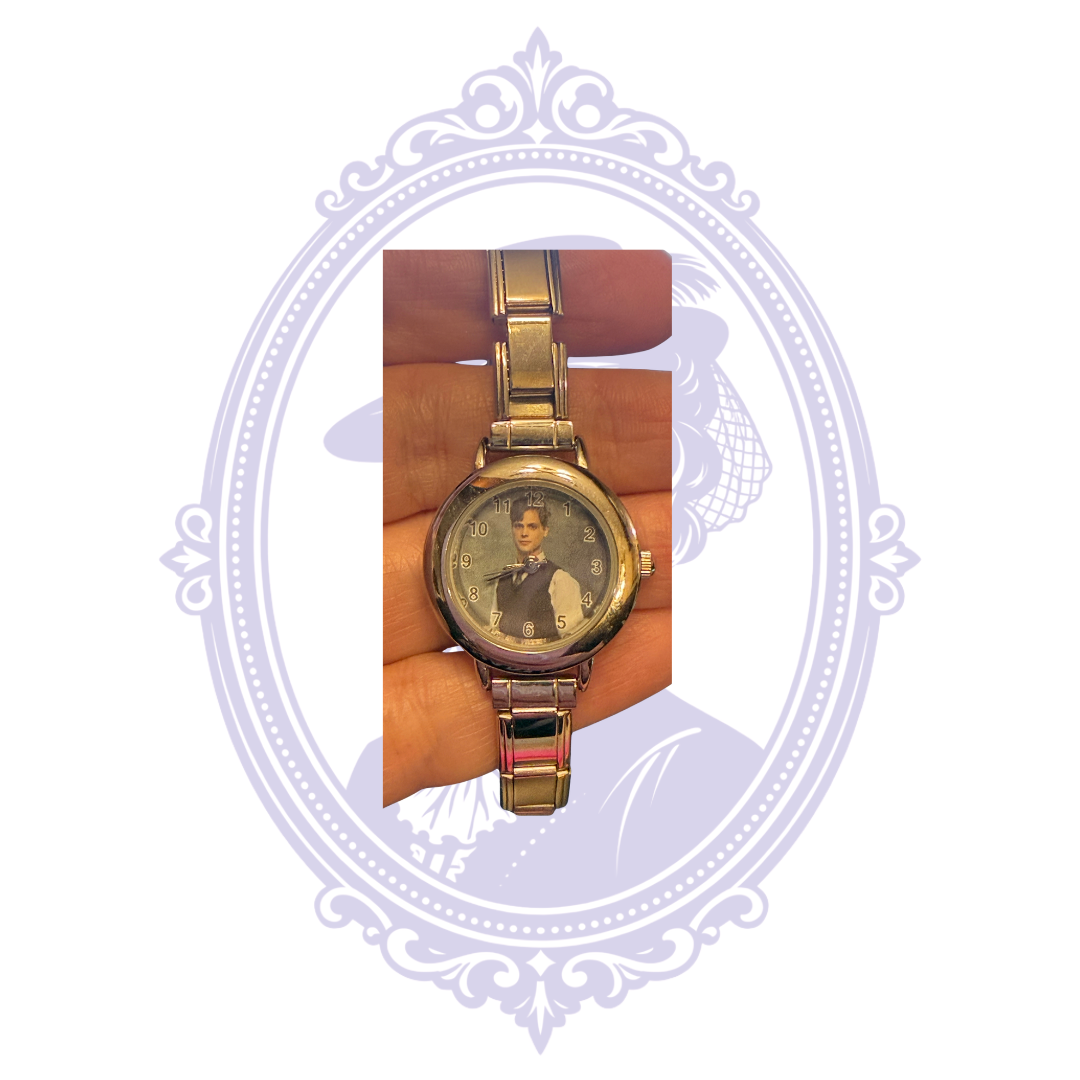 Front of silver-tone Dr Spencer Reid character bracelet watch