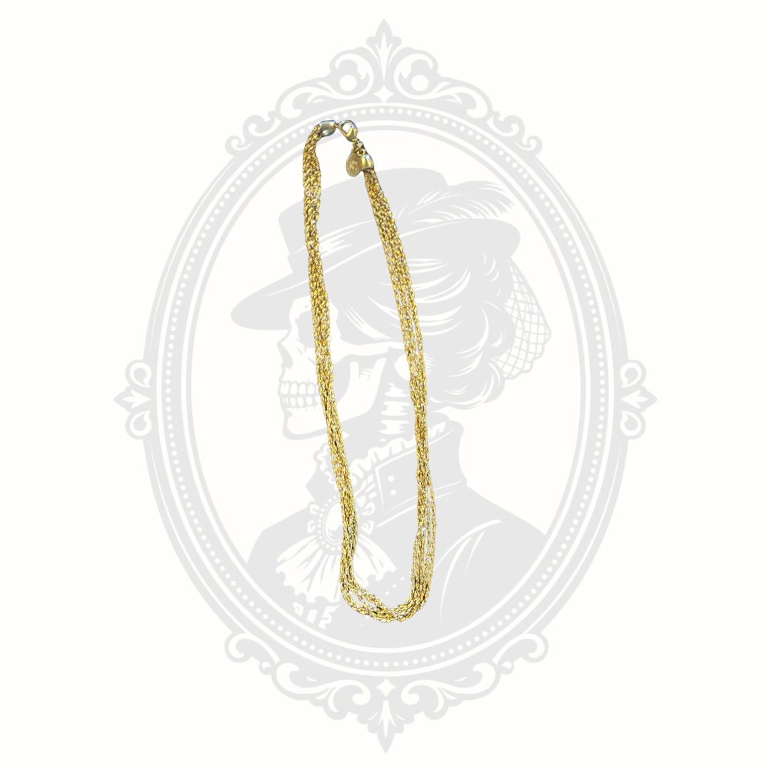 Signed Nolan Miller vintage gold-tone necklace featuring multiple textured strands and a layered chain design with lobster clasp closure.
