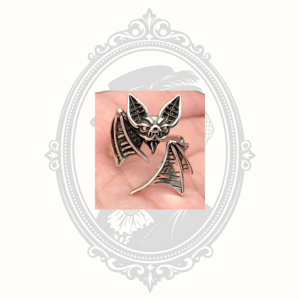 Front detail of the silver-tone bat ring with textured wings and gothic styling.