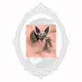 Front detail of the silver-tone bat ring with textured wings and gothic styling.