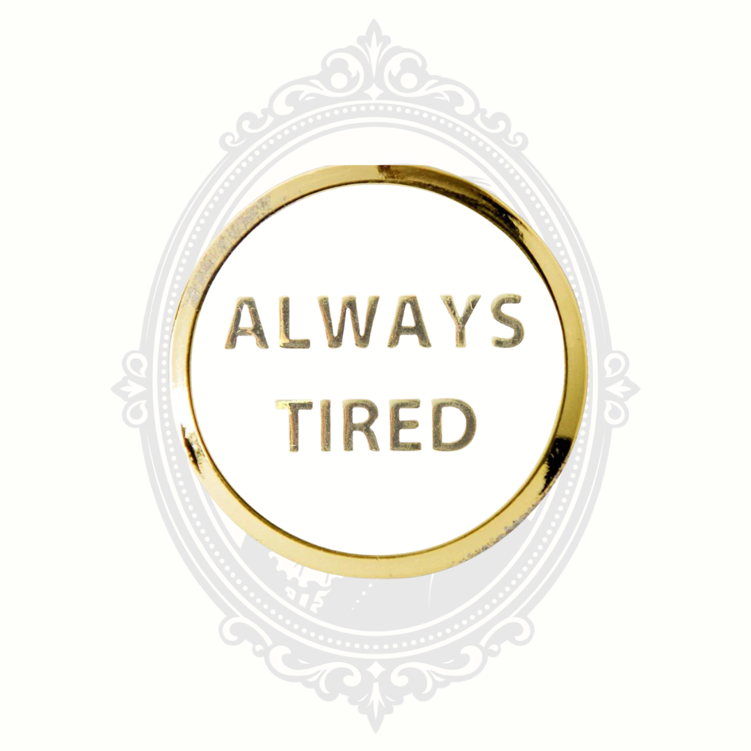 Gold-tone novelty pet tag engraved with the phrase “Always Tired.”
