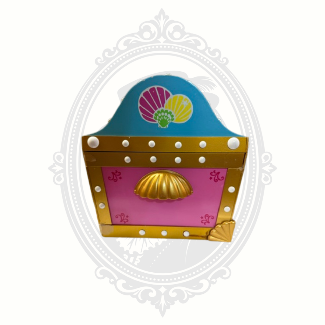 Side detail of Little Mermaid jewelry box with decorative shell and gold trim